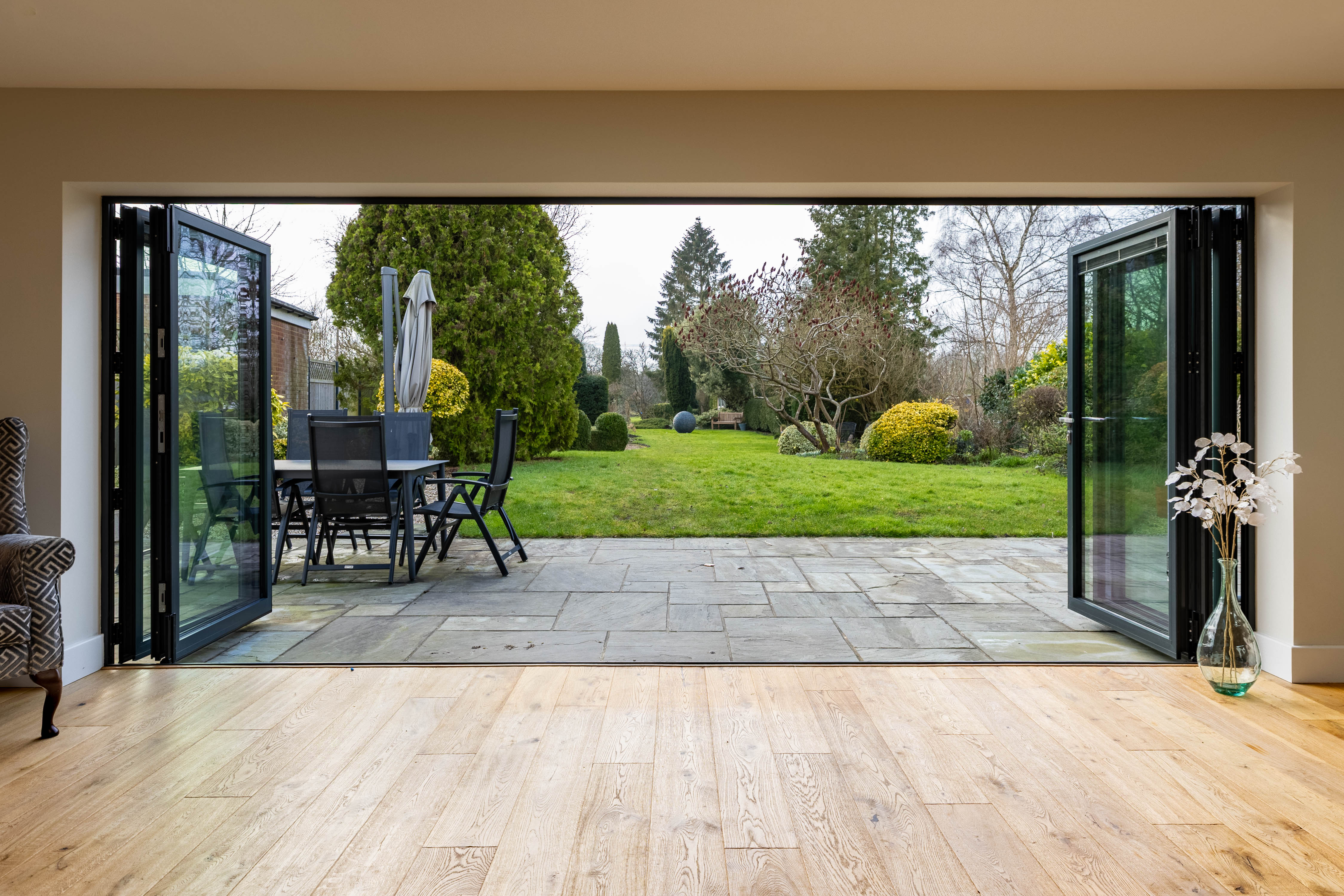 Open bifold doors through to a long narrow garden