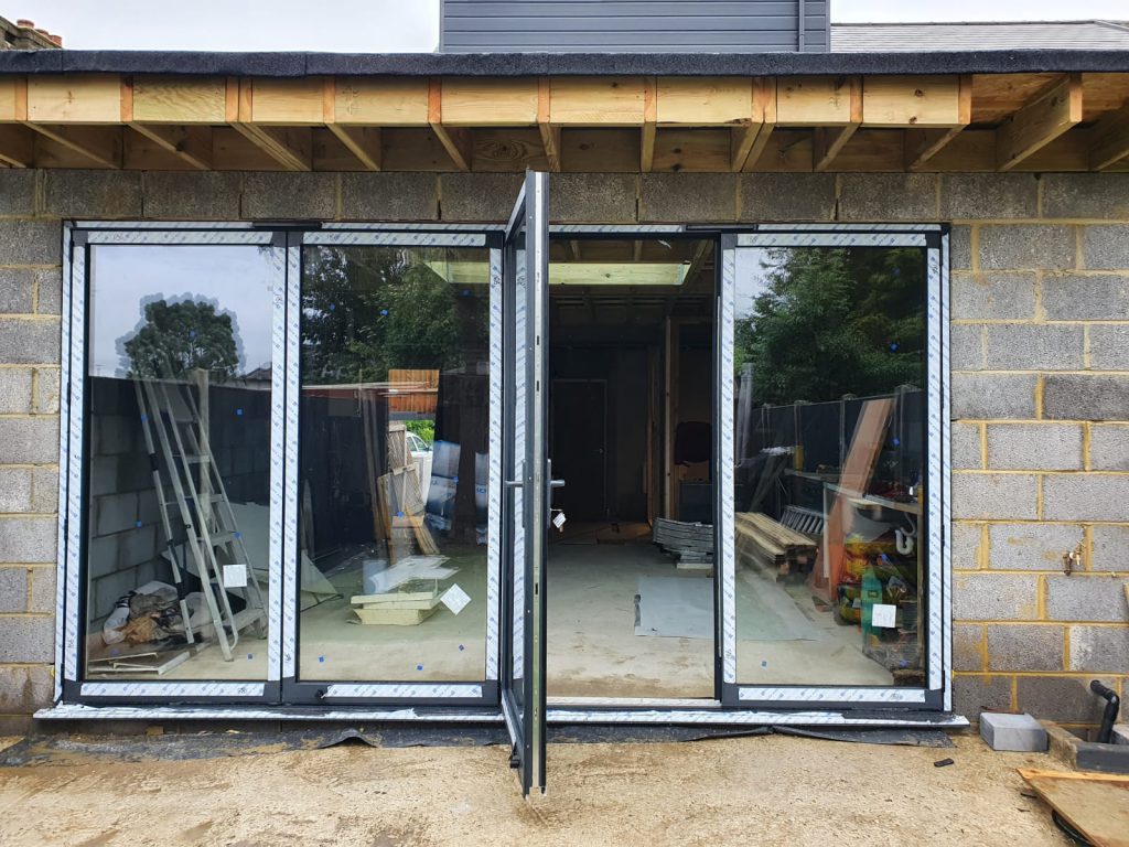 View of the construction phase of a bifold door installation